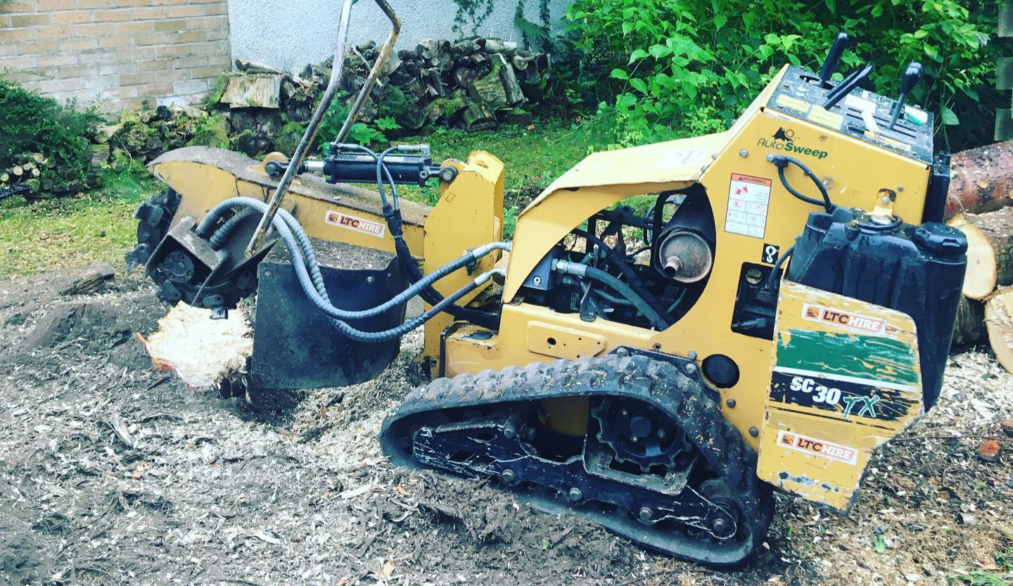 A yellow stump grinder